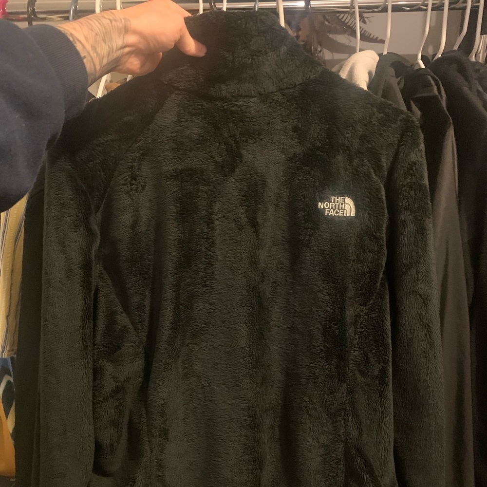 Black fuzzy north face jacket